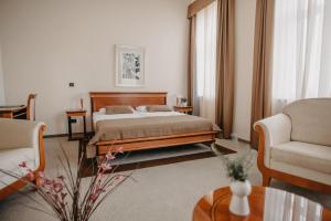 Łóżko lub łóżka w pokoju w obiekcie Hotel Villa Eugenia