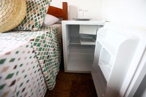 Postel nebo postele na pokoji v ubytování Hospedaria Tayrona