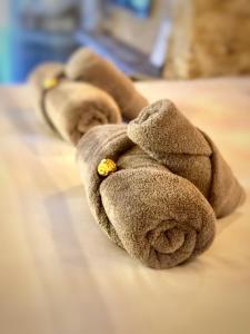 a pile of rolled up towels on a bed at Casa Poeta Pelayo in Cartagena