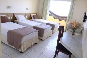 Postel nebo postele na pokoji v ubytování Grande Hotel de Juazeiro