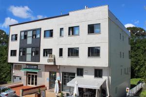 a large white building with a table in front of it at Peregrino in Pontevedra