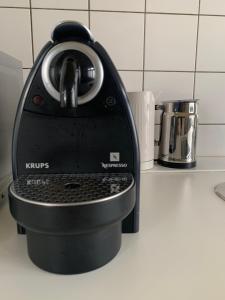 a coffee maker sitting on a kitchen counter at Canal Studio Apartment in Amsterdam