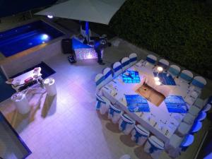 an overhead view of a table and chairs and a dj at Casa Quinta Santana in Melgar