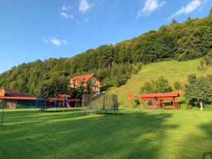 a field with a soccer goal on a hill at Hétvezér Panzió in Sub Cetate