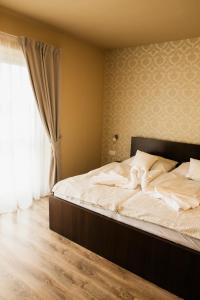 Postel nebo postele na pokoji v ubytování Jazmin apartmány