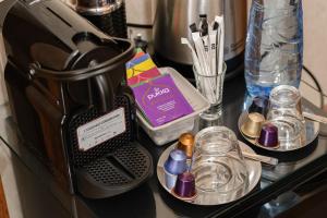 a counter with a coffee maker and other items on it at Beach House B&B in Dublin