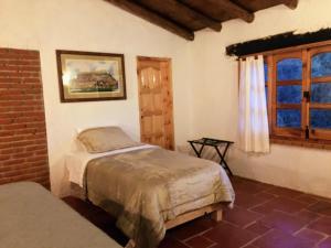 Postel nebo postele na pokoji v ubytování Hotel Del Rio
