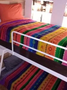 Un ou plusieurs lits dans un hébergement de l'établissement La Frida Casa Mexicana Lila 2o piso