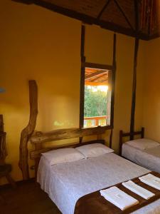 A bed or beds in a room at Pousada São Gonçalo