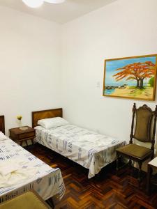 Cama ou camas em um quarto em Yellow Hostel Praia da Costa