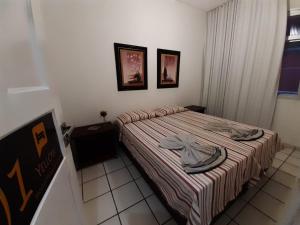 Cama ou camas em um quarto em Yellow Hostel Praia da Costa