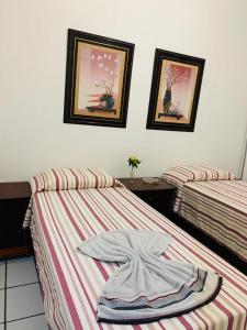 Cama ou camas em um quarto em Yellow Hostel Praia da Costa