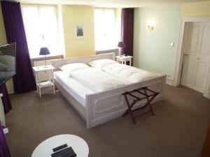 Ein Bett oder Betten in einem Zimmer der Unterkunft Rebstöckel Gästehaus WeinHof & Vinothek