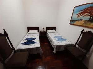 Cama ou camas em um quarto em Yellow Hostel Praia da Costa