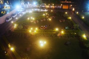 an aerial view of a park at night with lights at Hotel Sunrise N Resorts in Nagpur