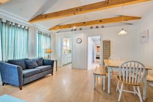 a living room with a couch and a table at Central Catalina Cottage Walk to Ferry and Eateries in Avalon