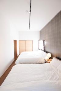 Postel nebo postele na pokoji v ubytování Bettei Gensen-Private Vacation Villa Bettei Gensen
