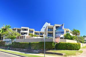 a building with a sign in front of it at Bellardoo Holiday Apartments in Mooloolaba