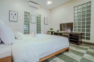 Postel nebo postele na pokoji v ubytování CALAO Kep Residence Hotel
