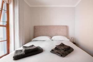 מיטה או מיטות בחדר ב-Stunning House in Bo Kaap