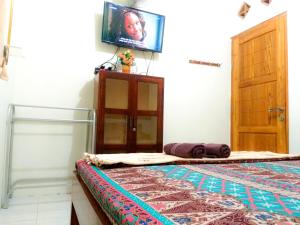 Sjónvarps- og/eða afþreyingartæki á Ngampilan Backpacker Hostel