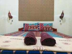 Ένα ή περισσότερα κρεβάτια σε δωμάτιο στο Ngampilan Backpacker Hostel