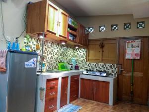 Eldhús eða eldhúskrókur á Ngampilan Backpacker Hostel