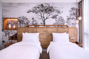 Postelja oz. postelje v sobi nastanitve Mercure Tangerang BSD City