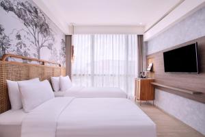 Postelja oz. postelje v sobi nastanitve Mercure Tangerang BSD City