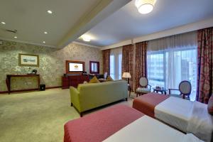 Cama ou camas em um quarto em Donatello Hotel