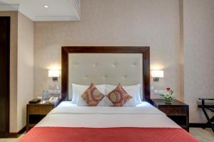 Cama ou camas em um quarto em Donatello Hotel