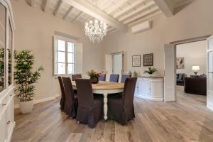 a dining room with a table and chairs at Lambert Apartment in Florence