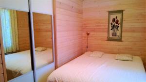 Postel nebo postele na pokoji v ubytování Villa Aurinkoranta
