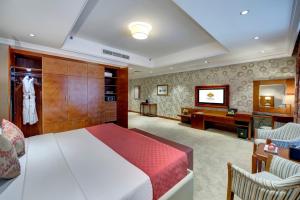 Cama ou camas em um quarto em Donatello Hotel