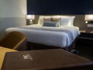 Postel nebo postele na pokoji v ubytování Ropewalk Piazza Hotel Managed by The Ascott Limited