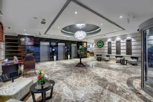 Uma área de estar em Donatello Hotel