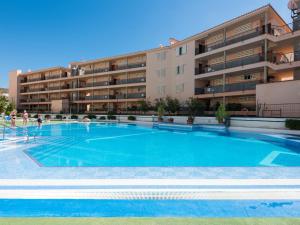 a large swimming pool in front of a building at 427 BEAUTIFUL SUMMERLAND STUDIO Wi-Fi Sat-Tv in El Guincho