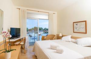Postel nebo postele na pokoji v ubytování Hotel Ancora