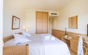 Postel nebo postele na pokoji v ubytování Hotel Ancora