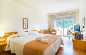 Postel nebo postele na pokoji v ubytování Hotel Ancora