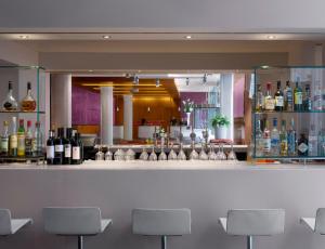 a bar with a lot of bottles of wine at Radisson Blu Hotel, Liverpool in Liverpool