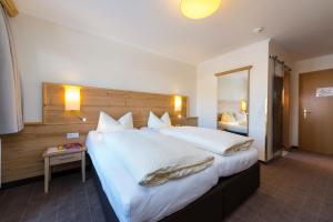 Postelja oz. postelje v sobi nastanitve Hotel Garni Entstrasser