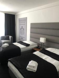 Posteľ alebo postele v izbe v ubytovaní A-Austerlitz Hotel