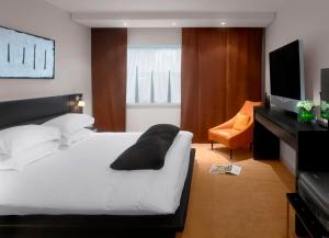 a hotel room with a bed and a television at Radisson Blu Hotel, Liverpool in Liverpool