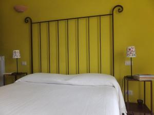 Postel nebo postele na pokoji v ubytování Cascina Antonini