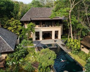 an aerial view of a house with a swimming pool at Four Seasons Resort Chiang Mai -SHA Plus in Mae Rim