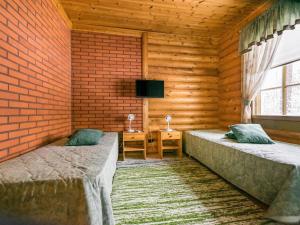 Postel nebo postele na pokoji v ubytování Holiday Home Kallionnenä by Interhome