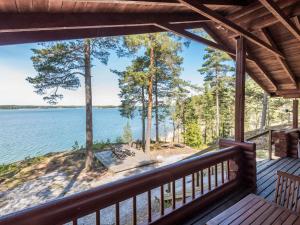 a view from the deck of a cabin on a lake at Holiday Home Merimetso by Interhome in Karuna