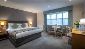 Krevet ili kreveti u jedinici u okviru objekta Westgrove Hotel