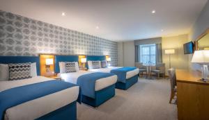 Krevet ili kreveti u jedinici u okviru objekta Westgrove Hotel